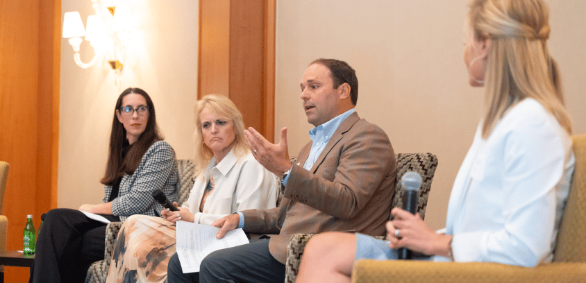 Amanda Barefoot, Pamela Genske, Brandon Moorefield, and Krista Beckwith participate in a Marathon Health roundtable panel, each seated with a microphone.