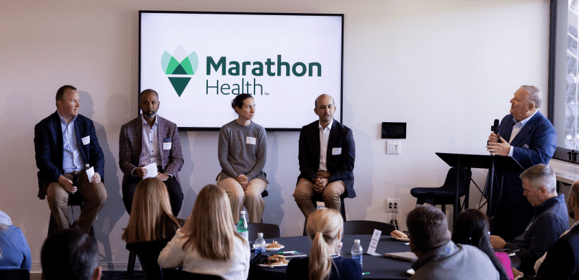 Jamie Smith moderates Marathon Health's Cornerstone 2026 workforce wellness panel for employers at TQL Stadium in Cincinnati, Ohio.