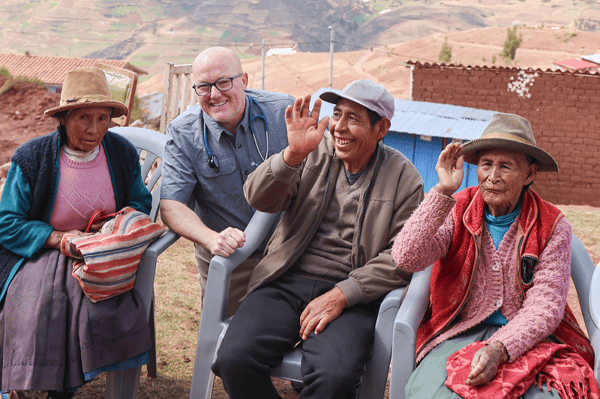 Randy-with-Peru-residents-in-the-mountans-Torch