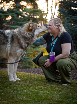 ENGAGE 2026 attendee playing with a dog.