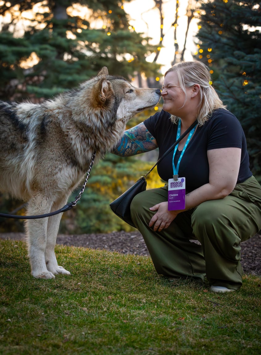 ENGAGE 2026 attendee playing with a dog.