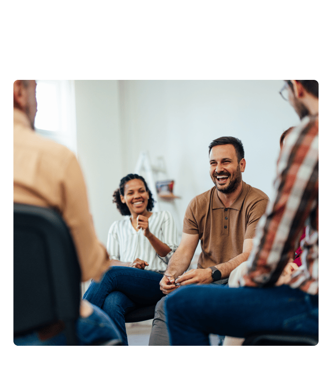 Small group of people seated in a circle at the Healthy Hearts Program.