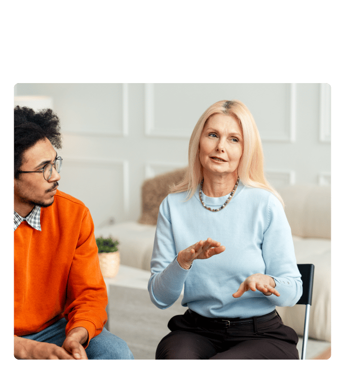 Two people seated together in a bright room, engaged in conversation about metabolic syndrome.
