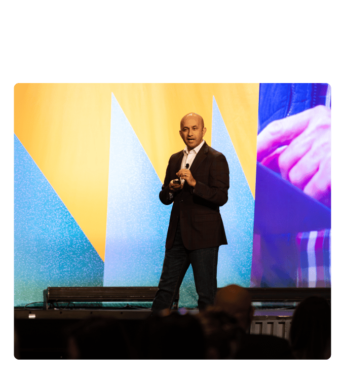 Dr. Nirav Vakharia speaking on stage at ENGAGE 2025.