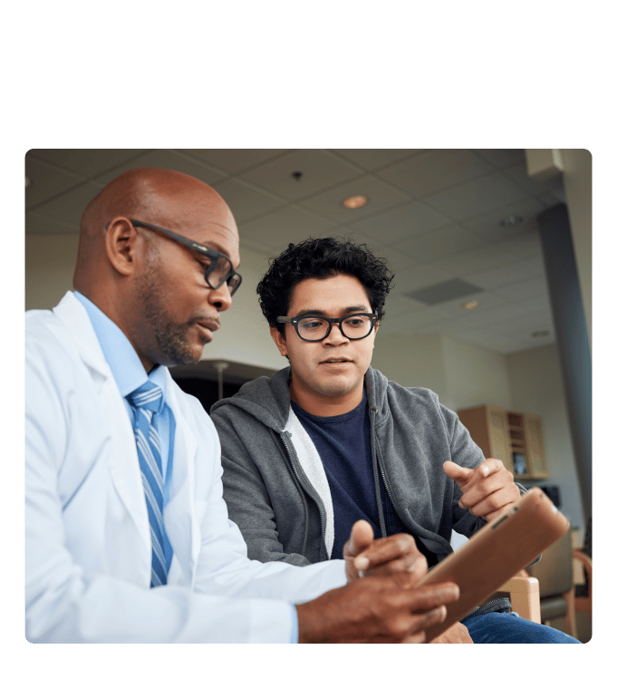 Healthcare provider reviewing Garner data on a tablet with a person.