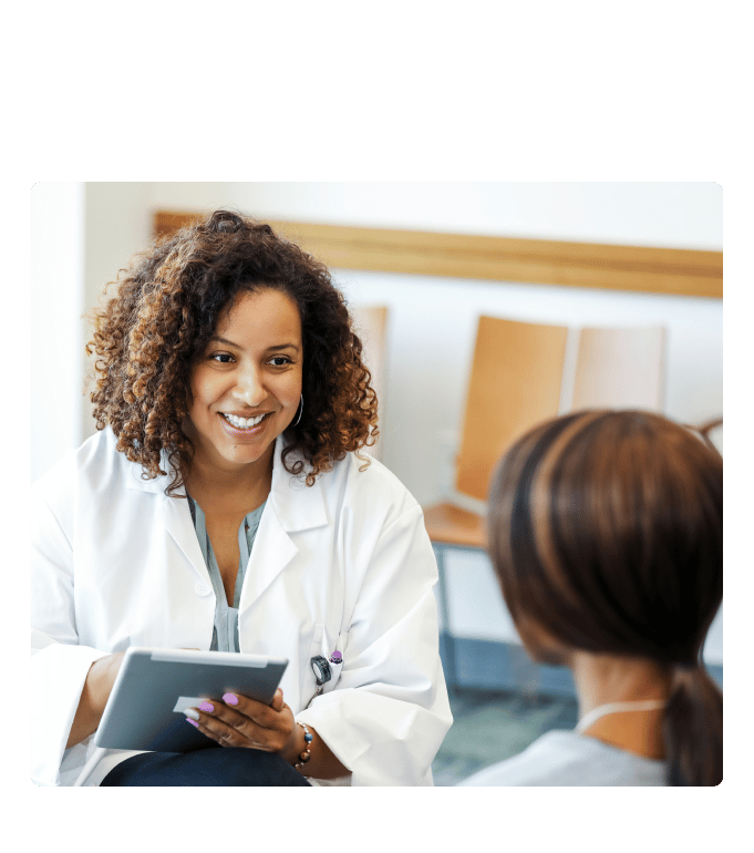 Healthcare provider speaking with a patient about GLP-1 drugs for weight loss.