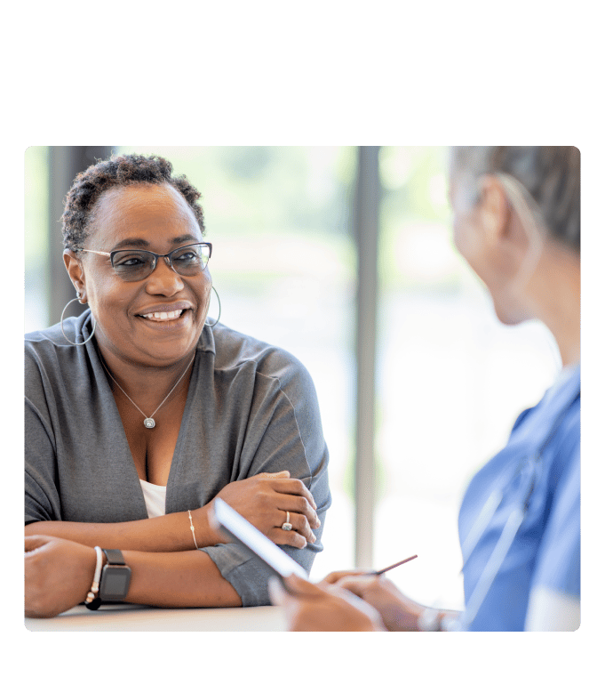Person smiling while speaking with a care navigator.