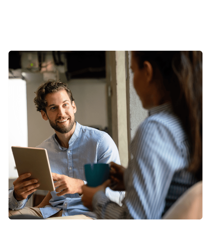 HR and an employee discussing mental health in an office.