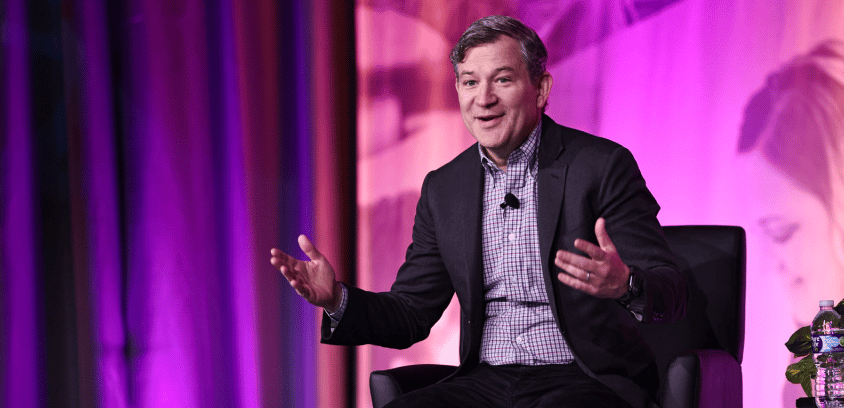 Dan Harris speaking on stage at Engage 2025.