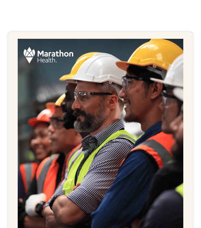 A group of workers in hard hats and high-visibility vests standing together