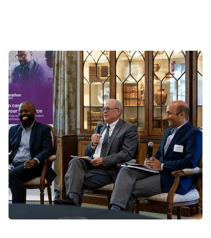 Dr. Raynard Washington, Chris Paterson, and Dr. Nirav Vakharia at the Marathon Health Charlotte roundtable.