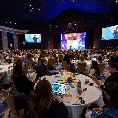 ENGAGE 2026 conference room filled with attendees.