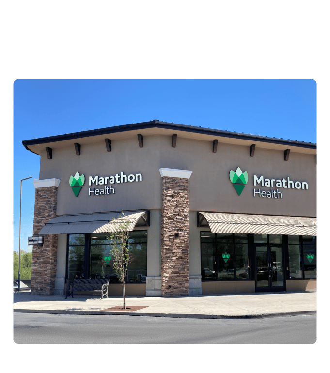 Exterior of a Marathon Health network health center with branded signage.