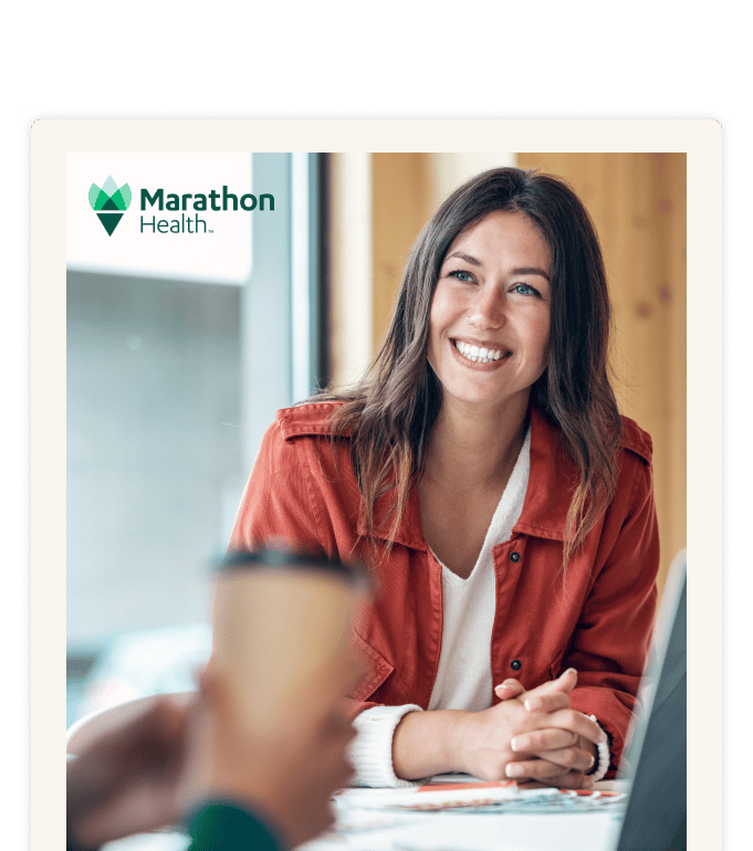 Report cover with the Marathon Health logo: a smiling person in an orange jacket at a cafe table with a laptop