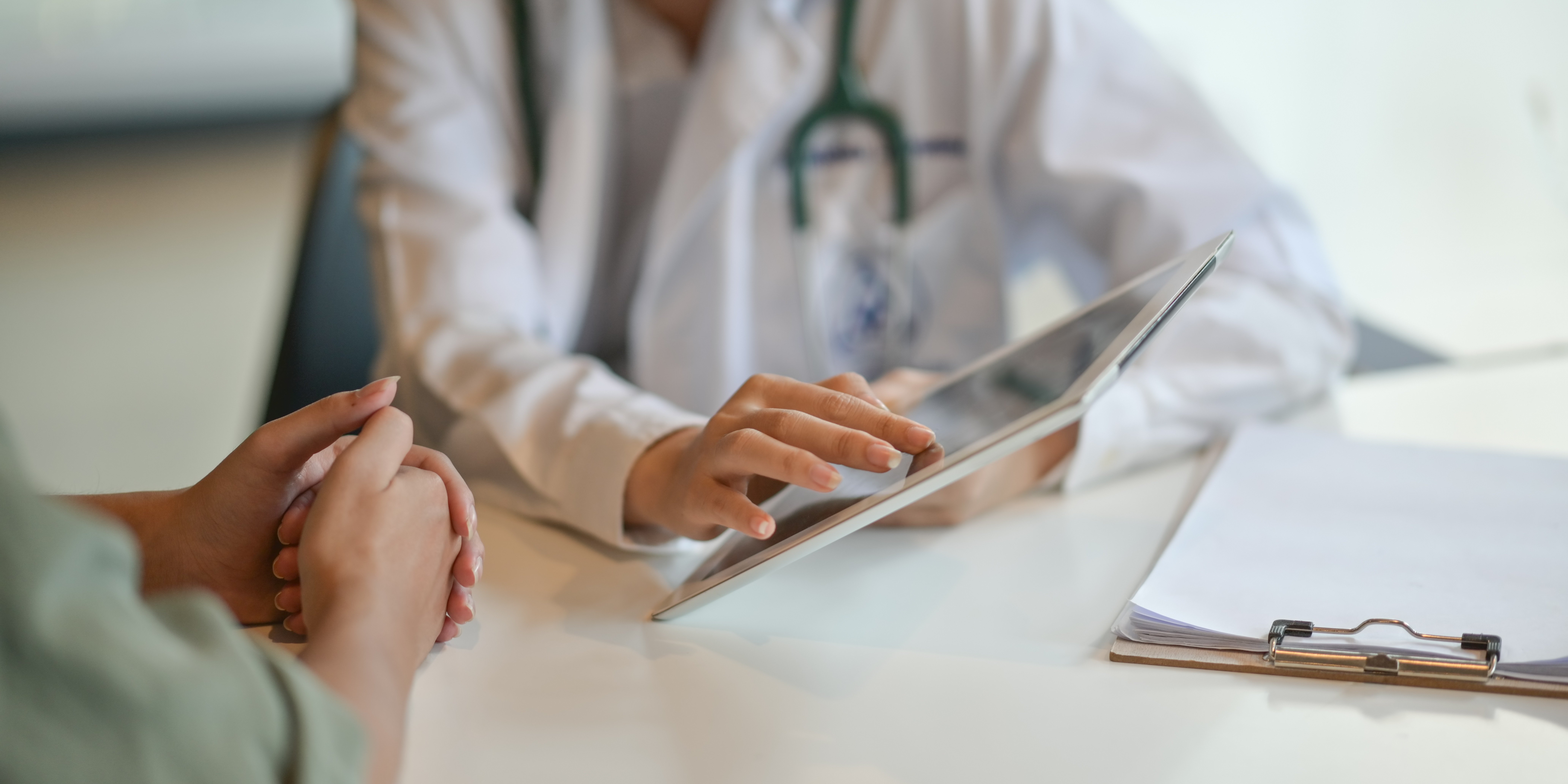 Doctor showing patient a chart on a tablet