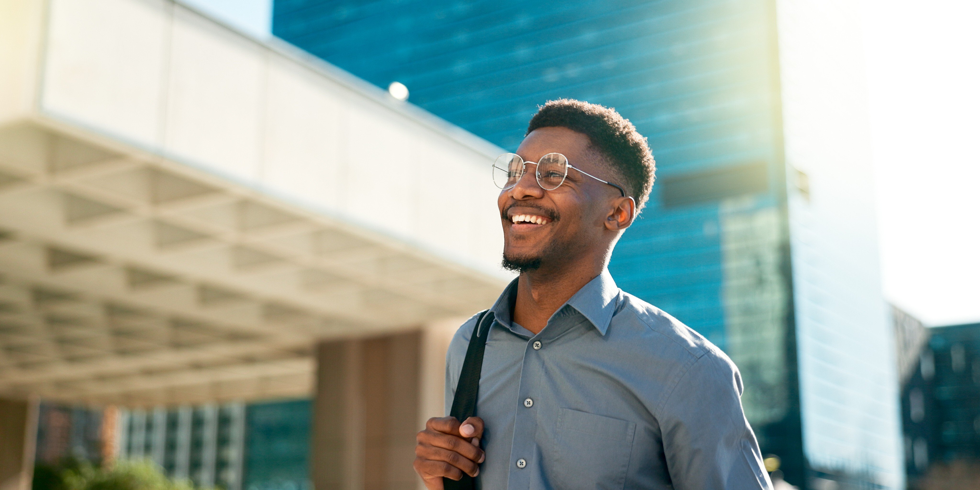 Smiling employee walking to work