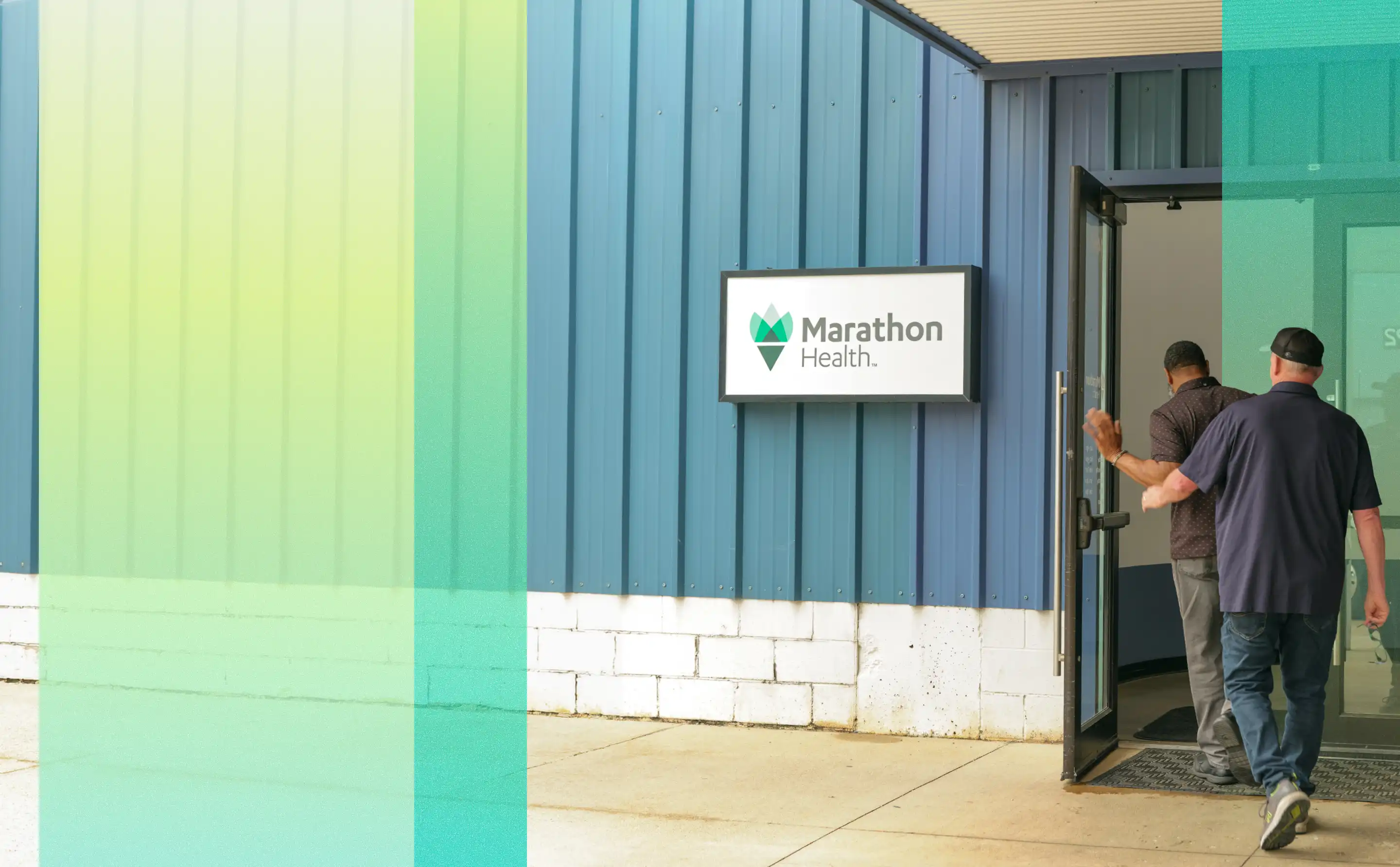 Two people entering a Marathon Health onsite health center.
