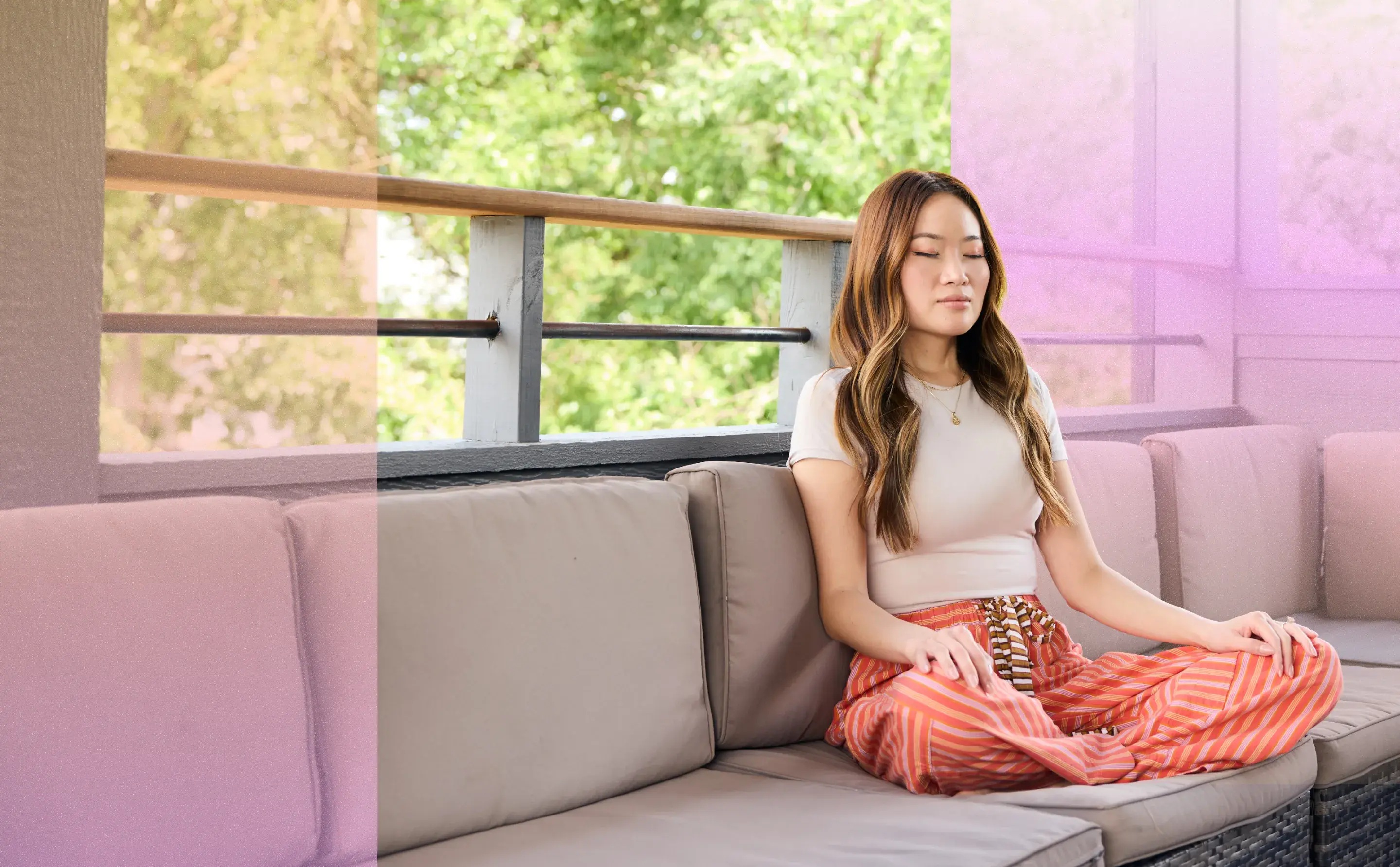 Woman with her eyes closed sitting on a couch meditating.to improve her mental health.