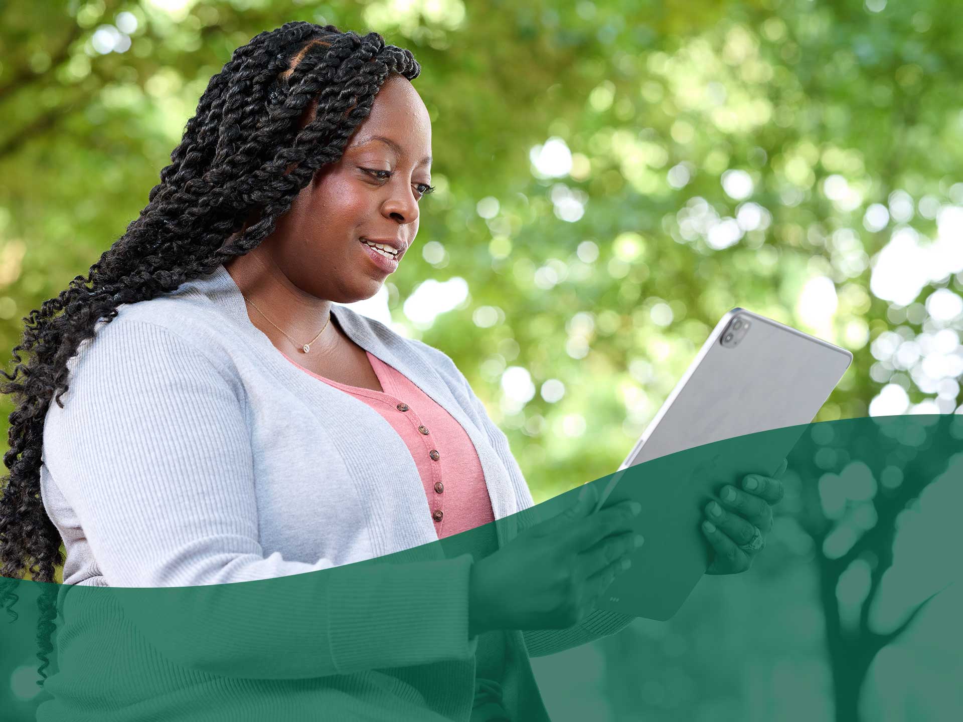 woman holding tablet