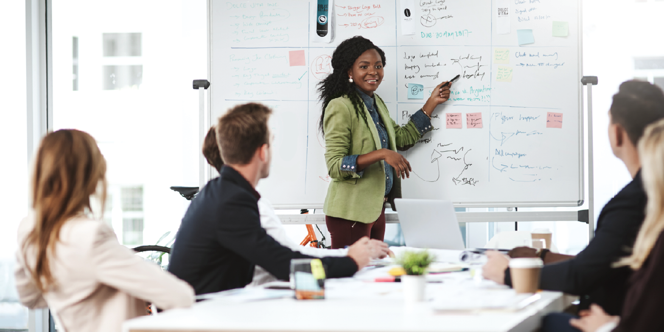 A financial leader running a business meeting