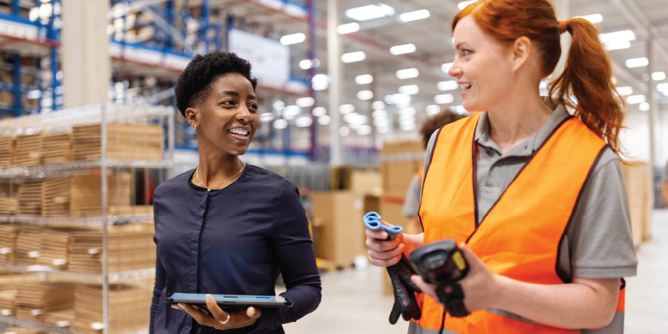 Manufacturing workers having a conversation