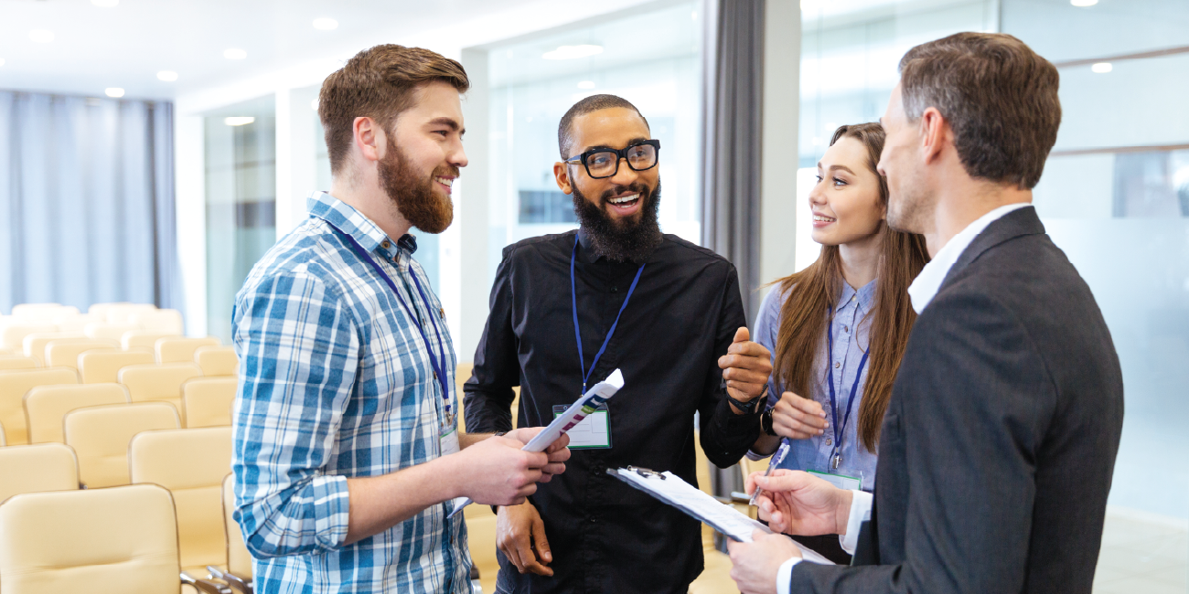 A group of employees talking in an office