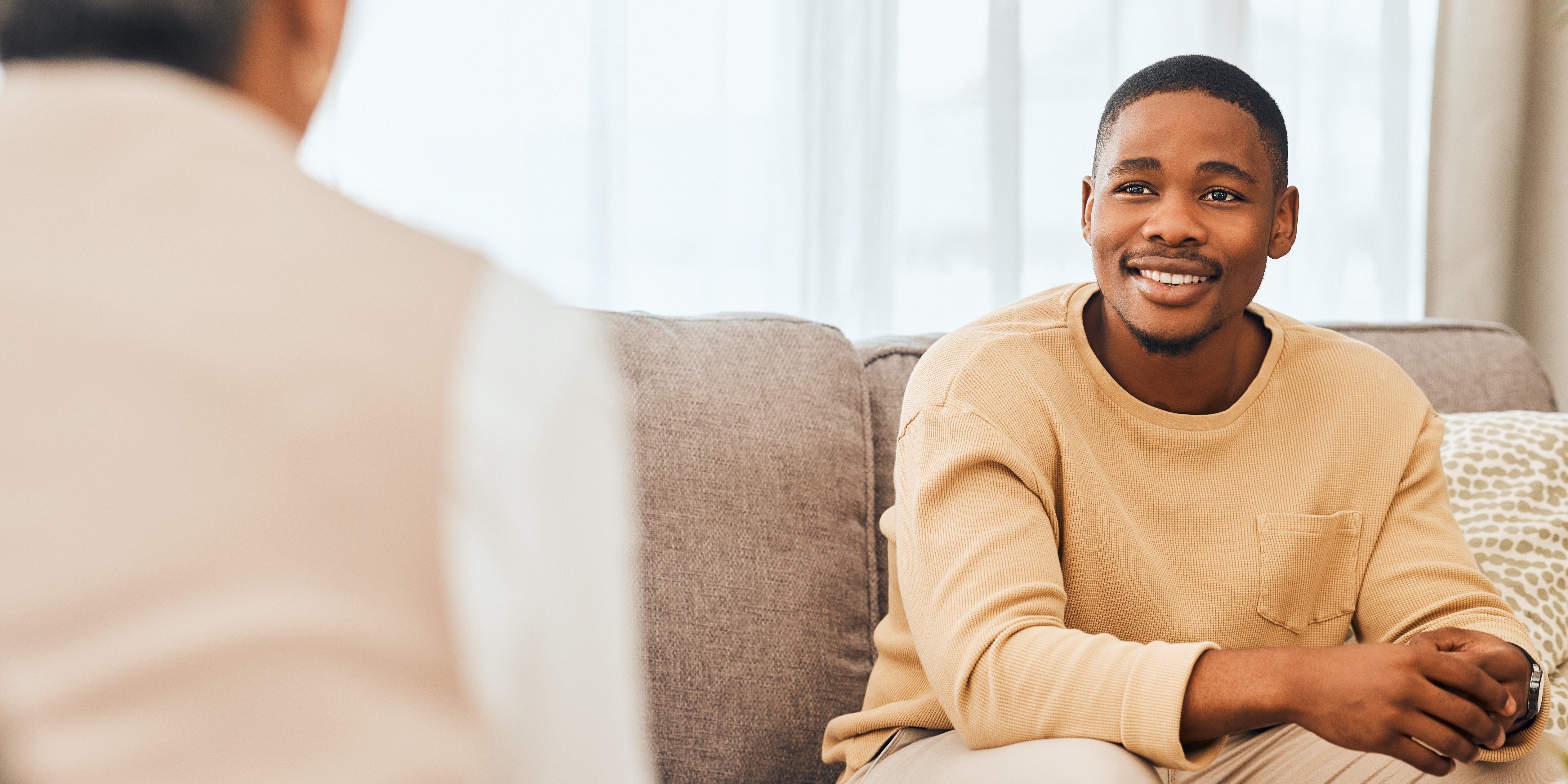 A man speaking to a mental health counselor