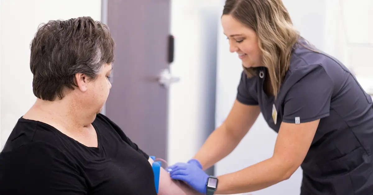 Biometric screening being administered by a nurse.