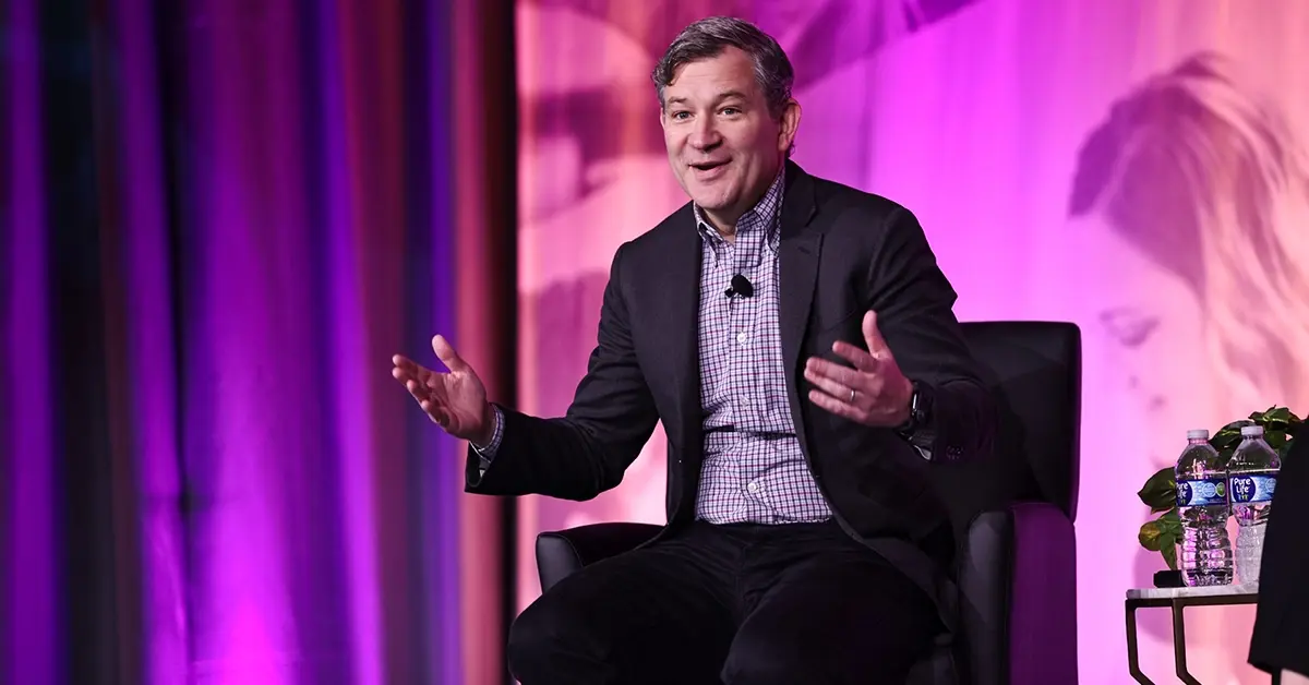 Close up of Dan Harris while speaking on stage.