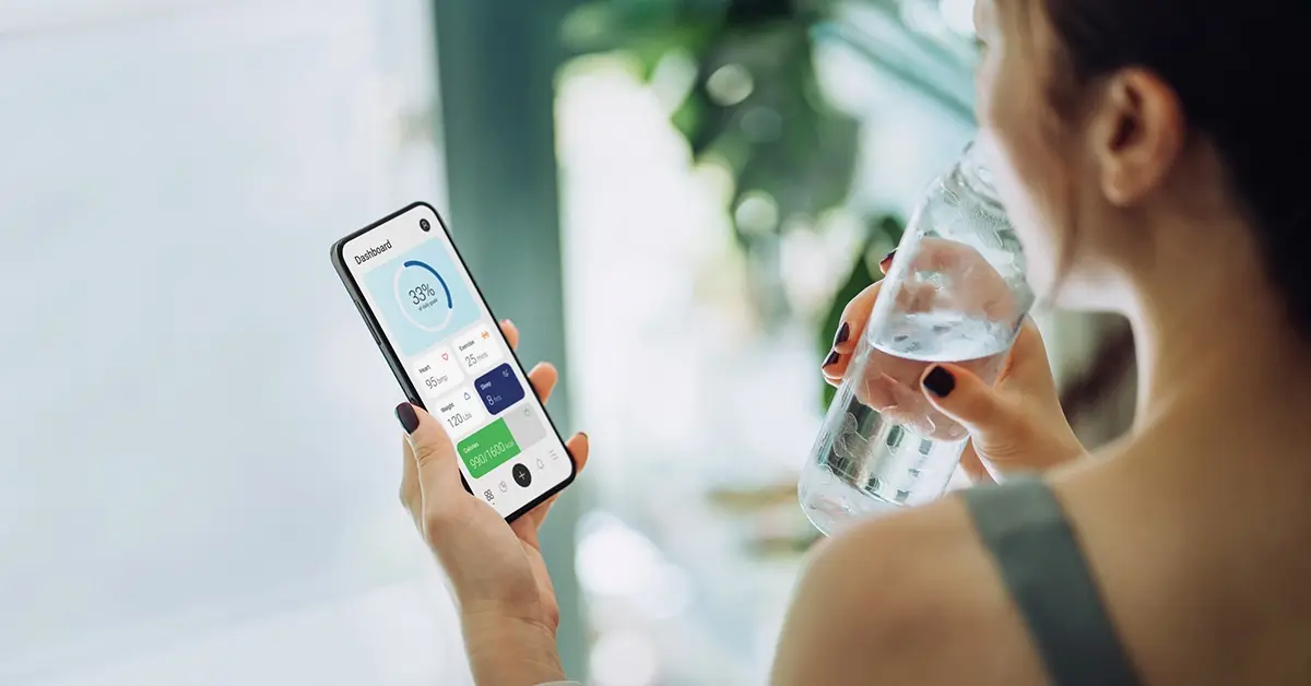 Employee checking wellness program progress on a mobile device.