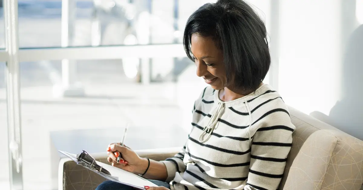 Woman completing a health risk assessment.