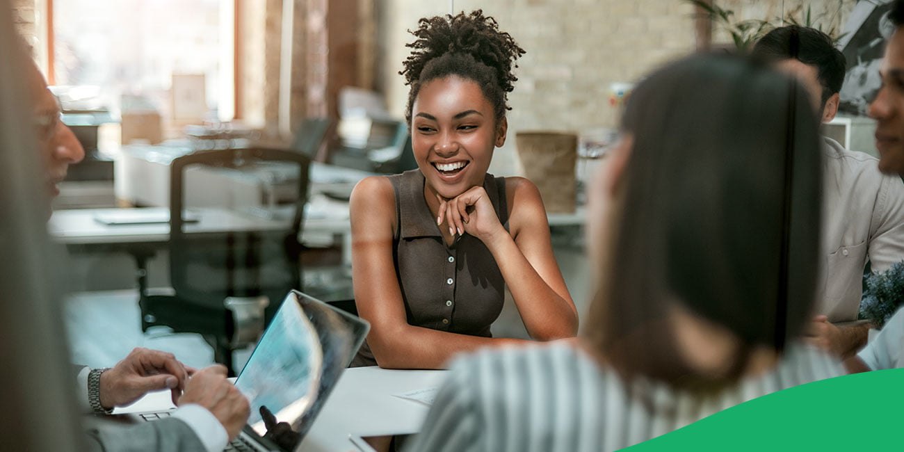 Group working together and smiling at a table