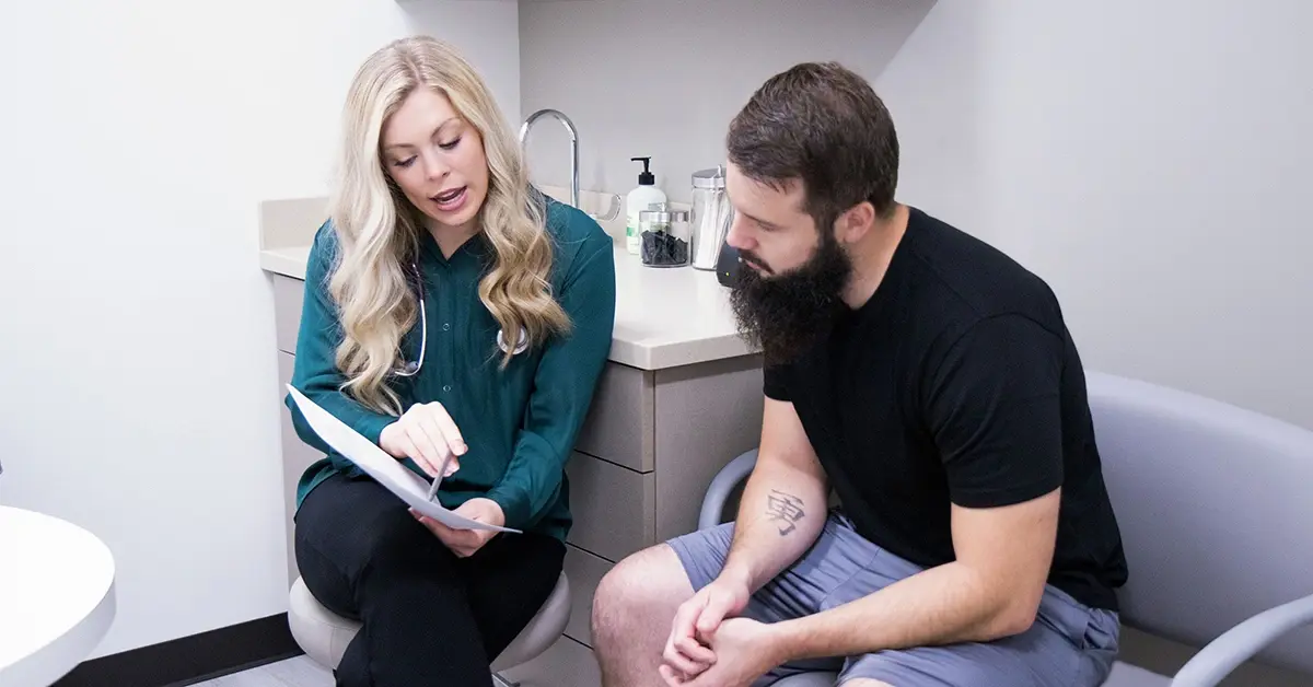 Healthcare provider using motivational interviewing during a patient coaching conversation.