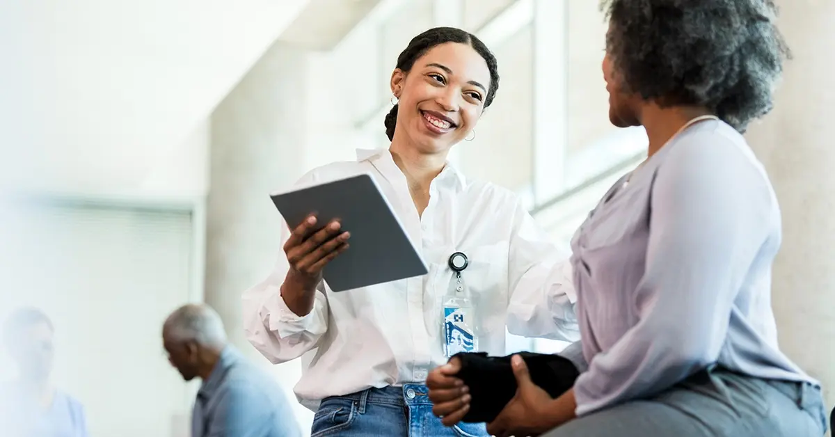Employee meets with an onsite occupational health services provider for a checkup.