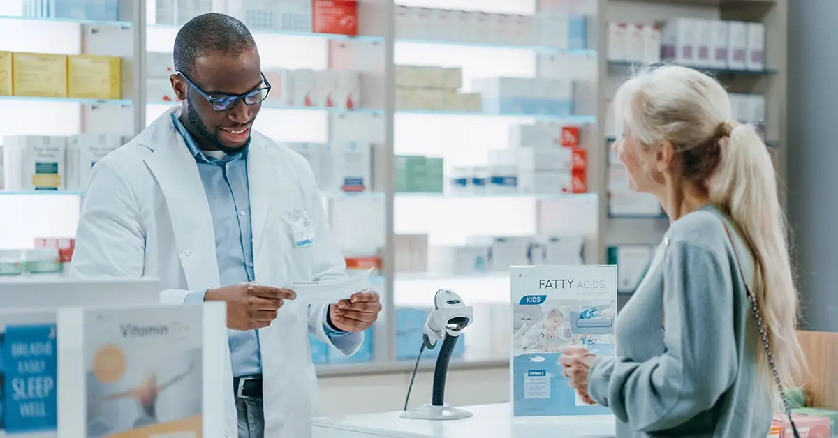 A patient speaking with a pharmacist.