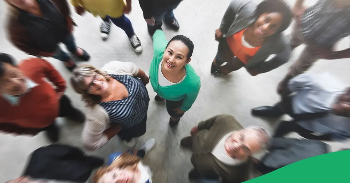 Population members looking up, smiling.