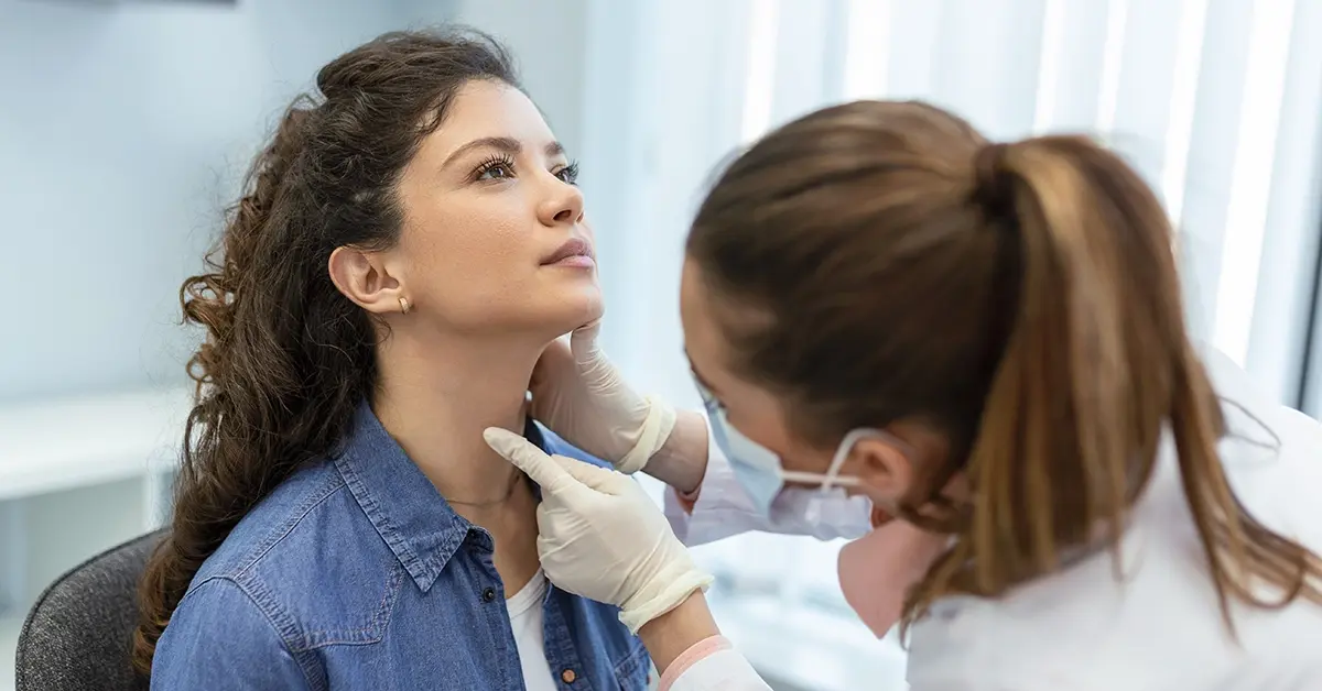 A primary care physician examining a patient.