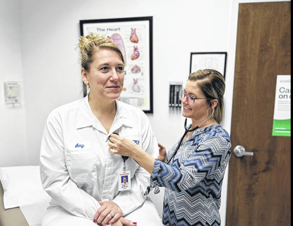 doctor checking patient heartbeat with stethoscope 