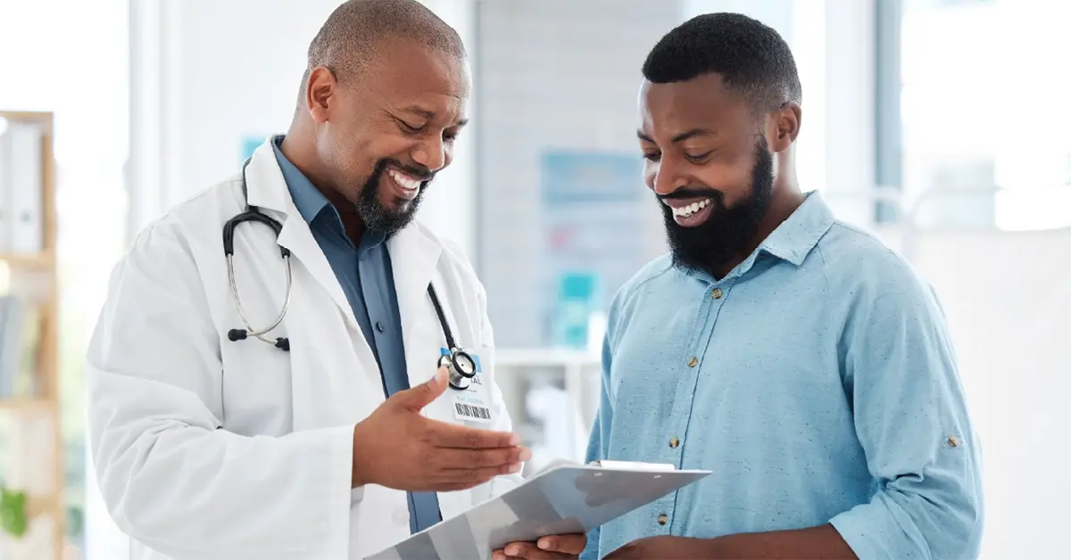 Small business employee speaking with a doctor.