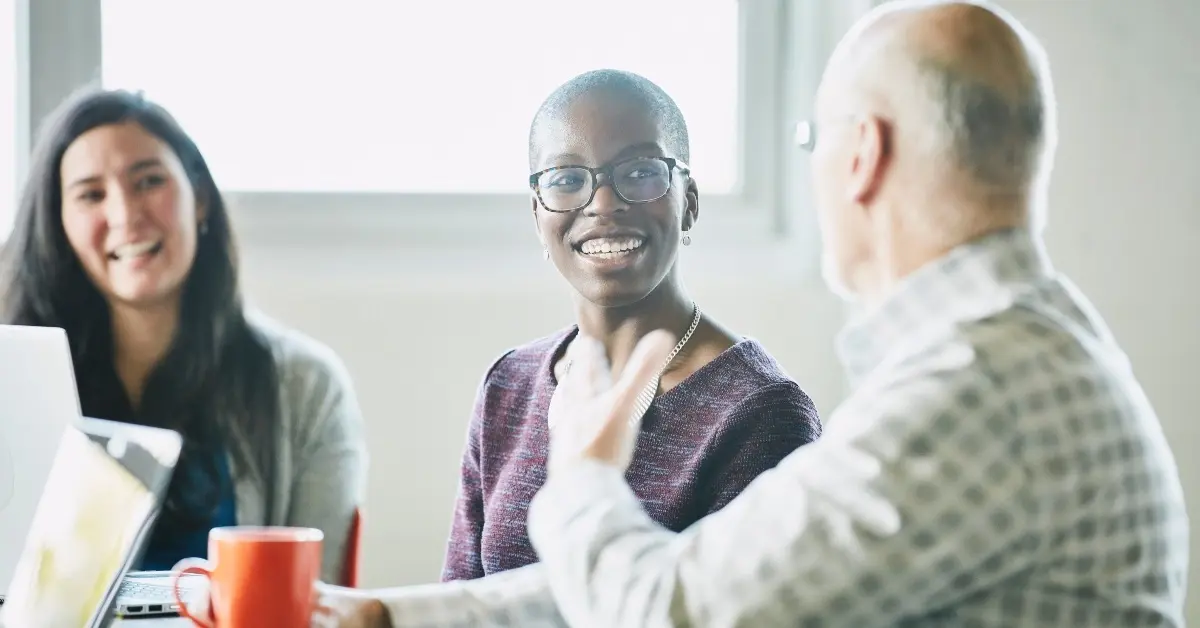 Employer performing a workplace ergonomic assessment.