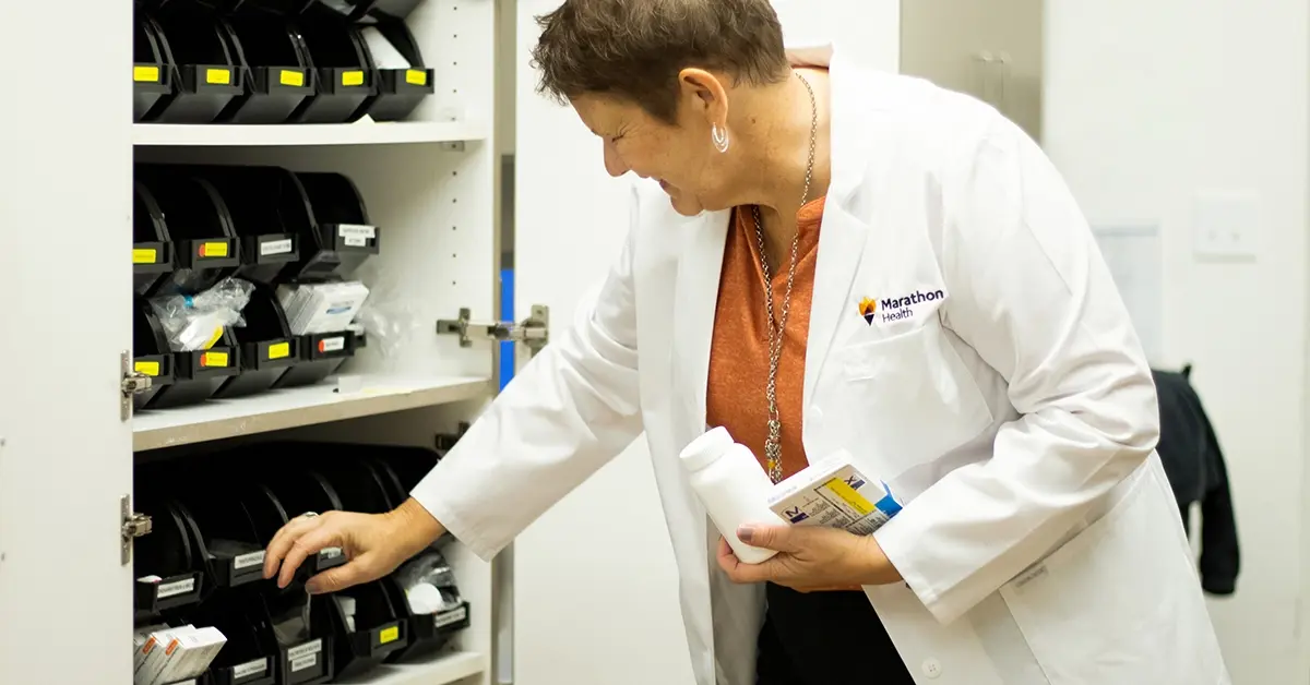 Worksite pharmacy doctor looking for medication.